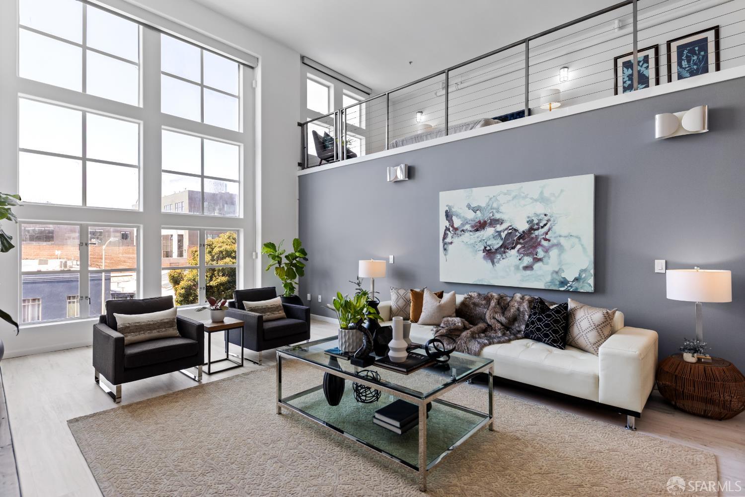 229 8th Street, Unit 3 San Francisco, CA 94103 - Photo 12 of 61 a living room with furniture and a large window