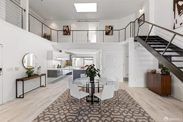 a view of a patio with couple of couches and deck