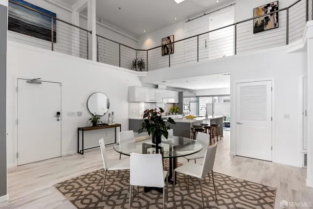 a kitchen that has a sink and a stove top oven