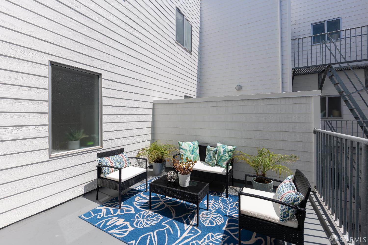 229 8th Street, Unit 3 San Francisco, CA 94103 - Photo 17 of 61 a view of a patio with couple of couches and deck