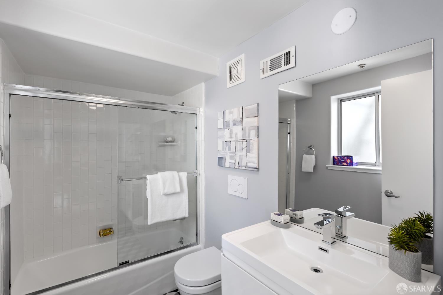 229 8th Street, Unit 3 San Francisco, CA 94103 - Photo 22 of 61 a bathroom with a sink toilet and shower