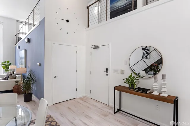 a bathroom with a sink and a potted plant