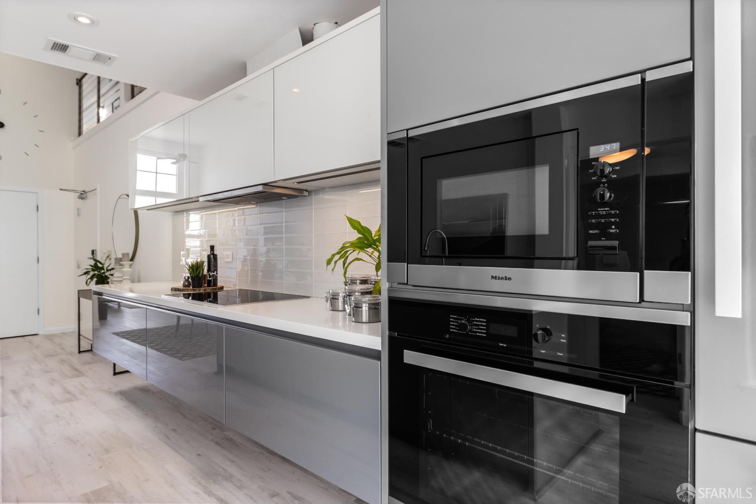 229 8th Street, Unit 3 San Francisco, CA 94103 - Photo 28 of 61 a kitchen with a stove and a microwave