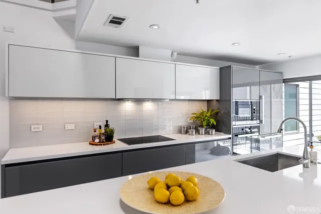 a bathroom with a sink a mirror and a shower