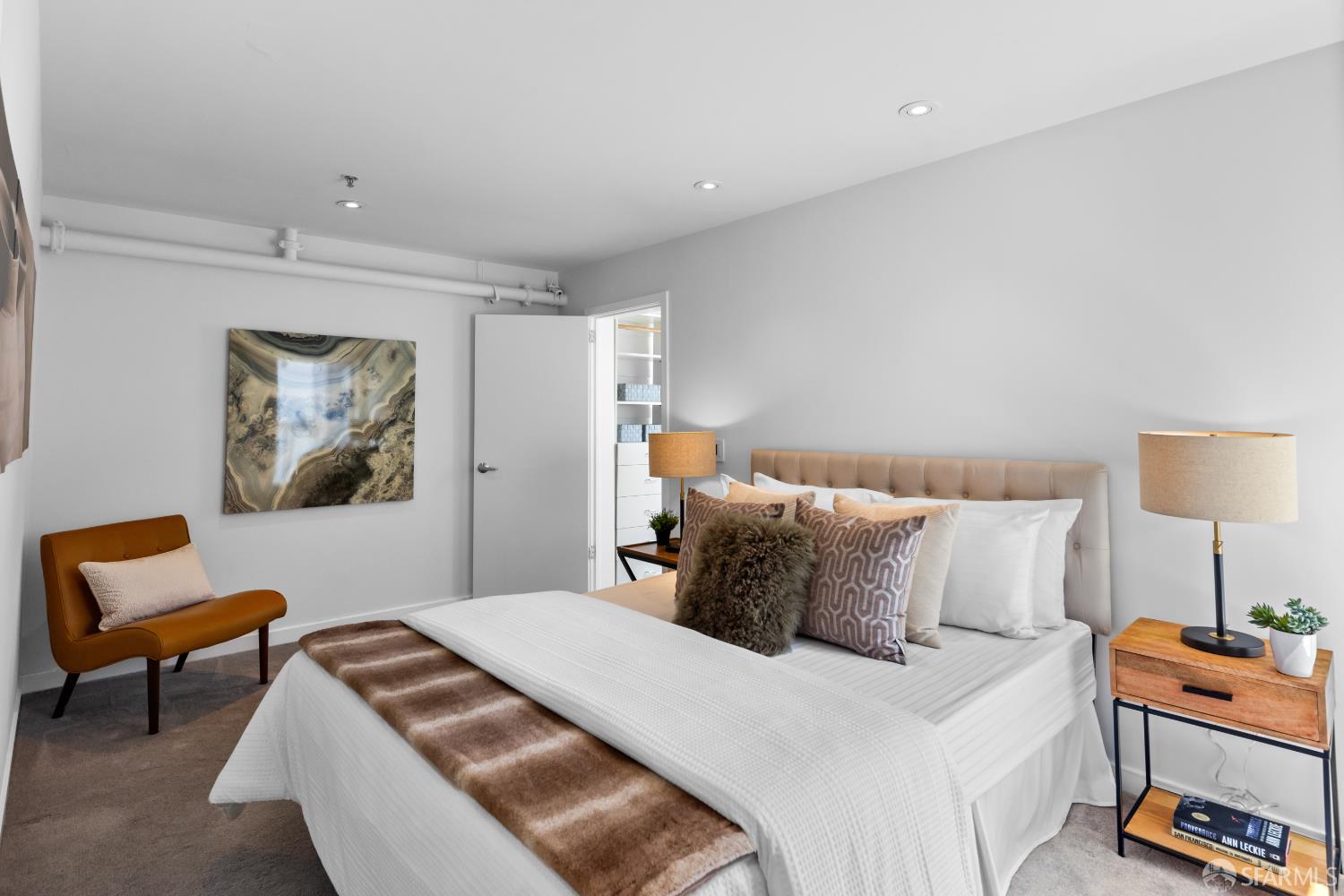 229 8th Street, Unit 3 San Francisco, CA 94103 - Photo 34 of 61 a bedroom with a bed and a couch