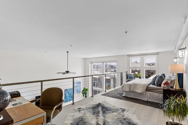 a bedroom with furniture and a fireplace