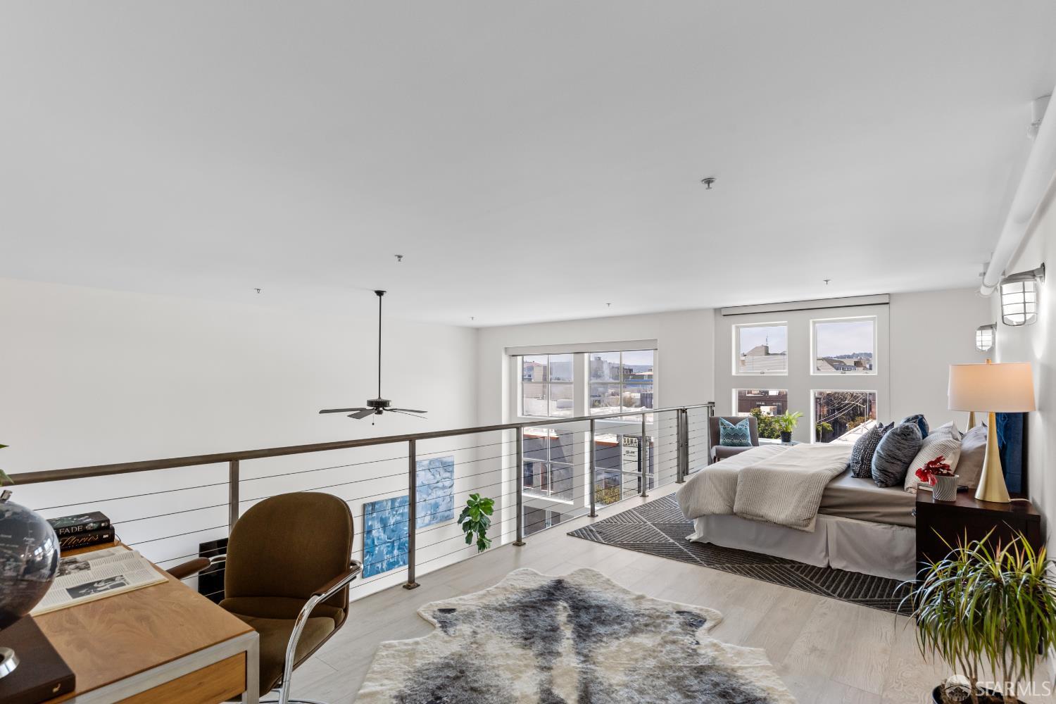 229 8th Street, Unit 3 San Francisco, CA 94103 - Photo 42 of 61 a living room with furniture and a large window