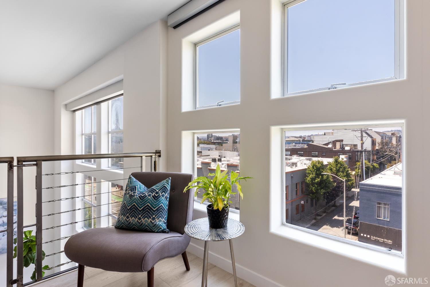 229 8th Street, Unit 3 San Francisco, CA 94103 - Photo 47 of 61 a room with furniture and a potted plant