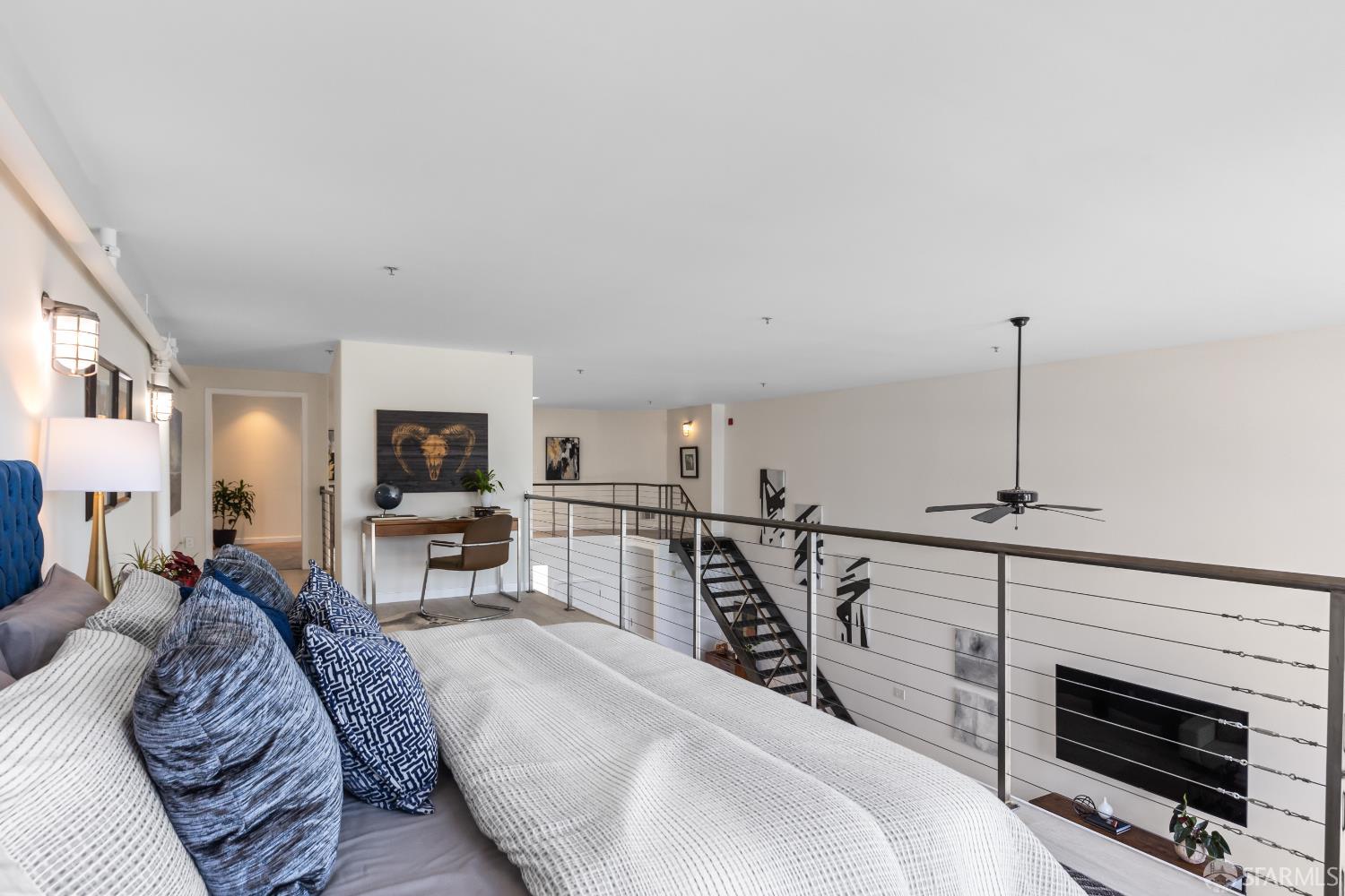 229 8th Street, Unit 3 San Francisco, CA 94103 - Photo 48 of 61 a living room with furniture a flat screen tv and a fireplace