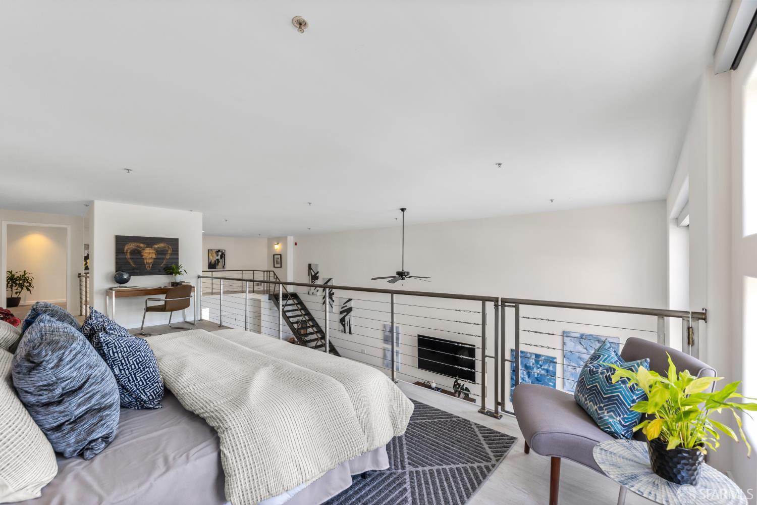 229 8th Street, Unit 3 San Francisco, CA 94103 - Photo 50 of 61 a bedroom with furniture and a fireplace