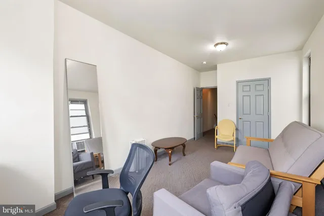 a work room with furniture and wooden floor