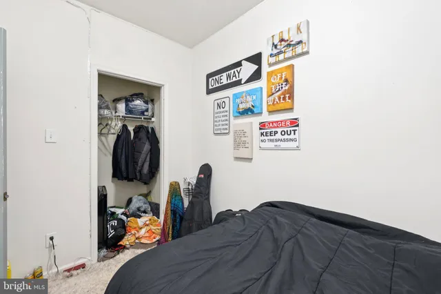 a bed room with a bed and a television