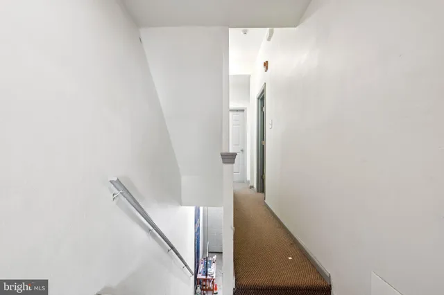 a view of a hallway with staircase