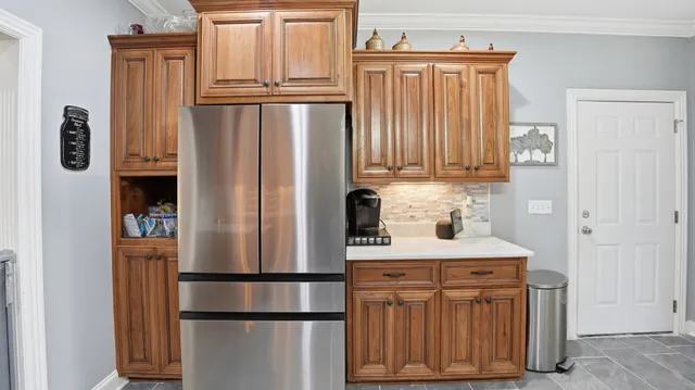 a kitchen that has a sink and a stove