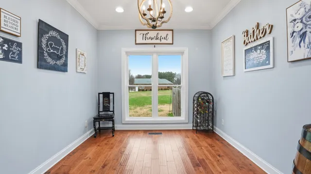 wooden floor with kitchen view