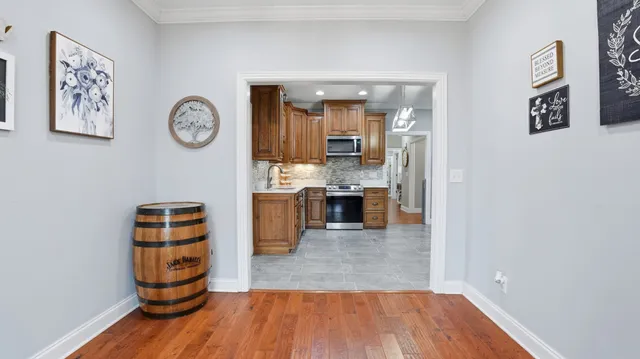 a view of a livingroom with workspace and a window