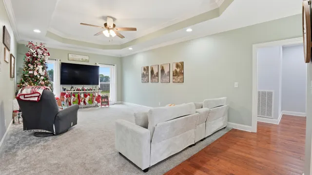 a view of a livingroom with furniture and a flat screen tv