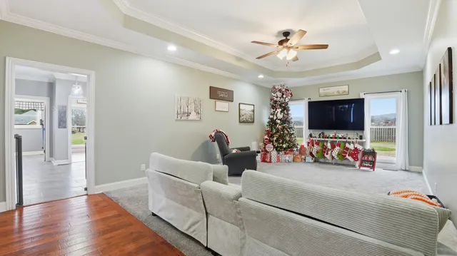 a living room with furniture and flowers