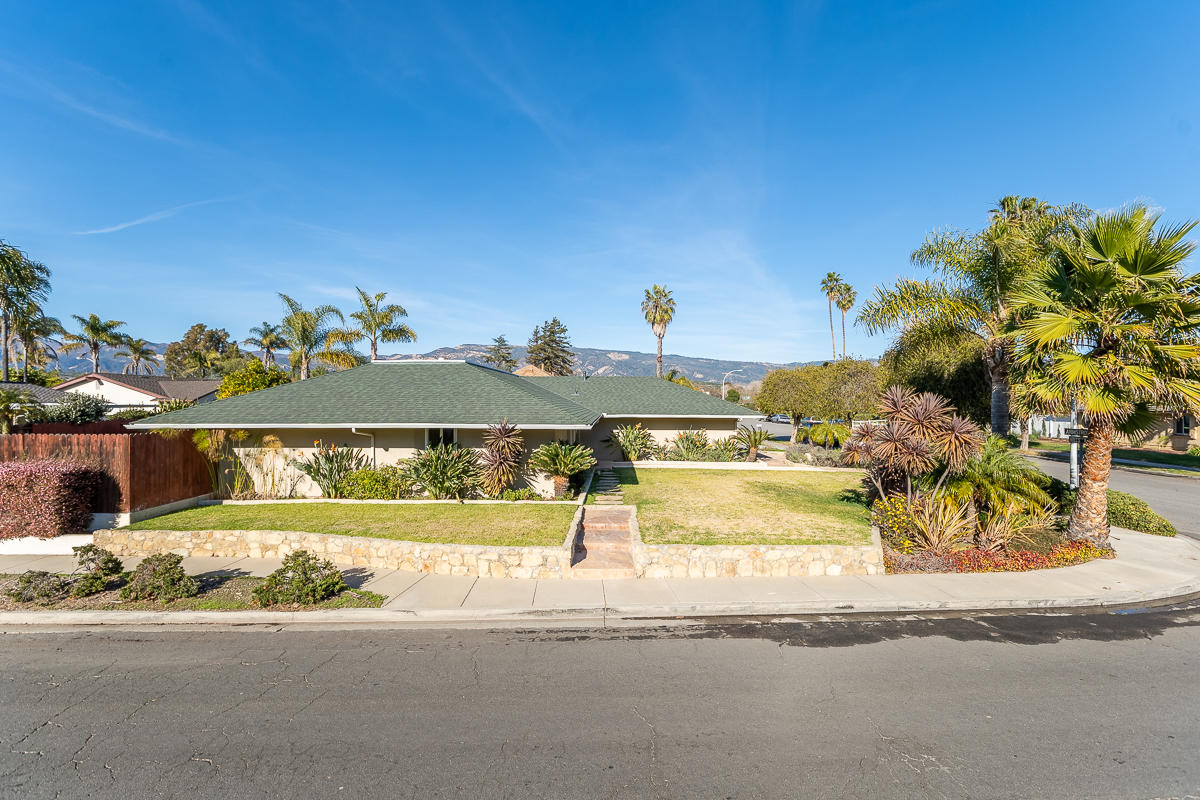467 Mills Way Goleta, CA 93117 - Photo 1 of 2 a view of a swimming pool with a lawn chairs and potted plants