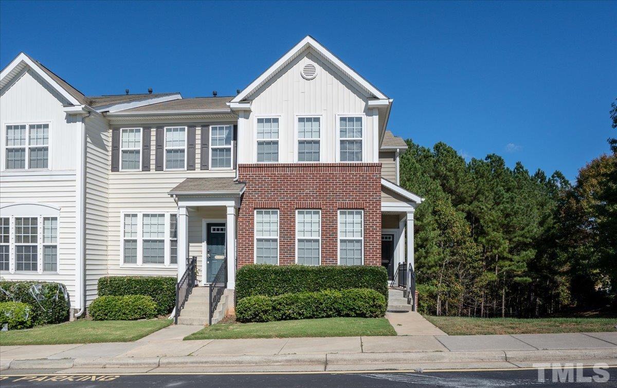 7604 Canvas Art Terrace Raleigh, NC 27617 - Photo 1 of 20 a front view of a house with a yard
