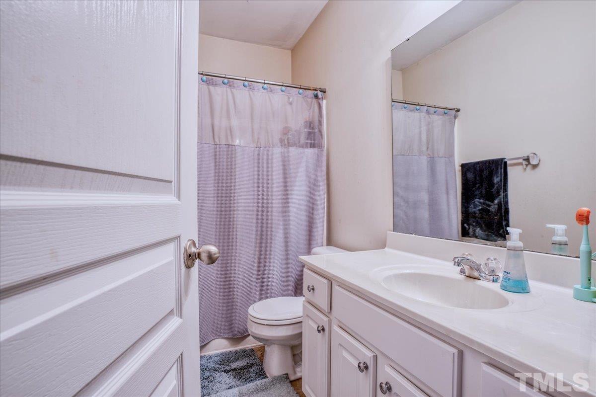 7604 Canvas Art Terrace Raleigh, NC 27617 - Photo 16 of 20 a bathroom with a sink a toilet a tub and shower