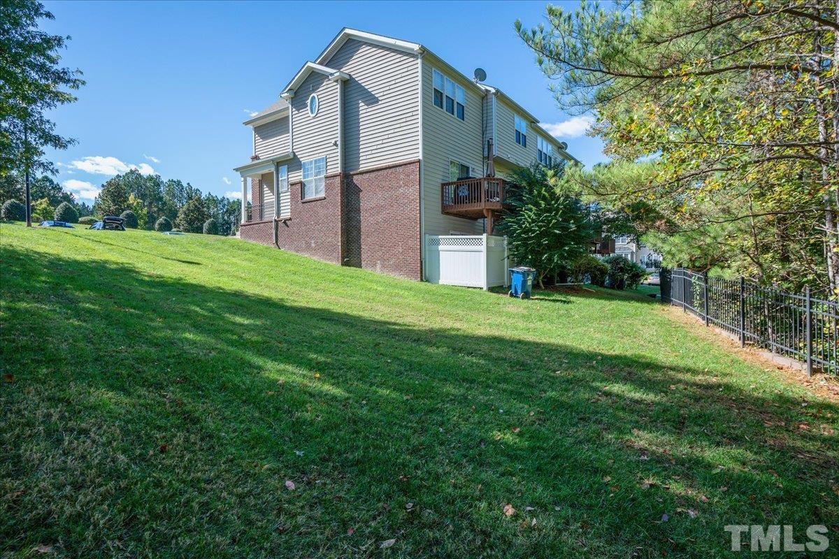 7604 Canvas Art Terrace Raleigh, NC 27617 - Photo 19 of 20 a view of a building with a yard