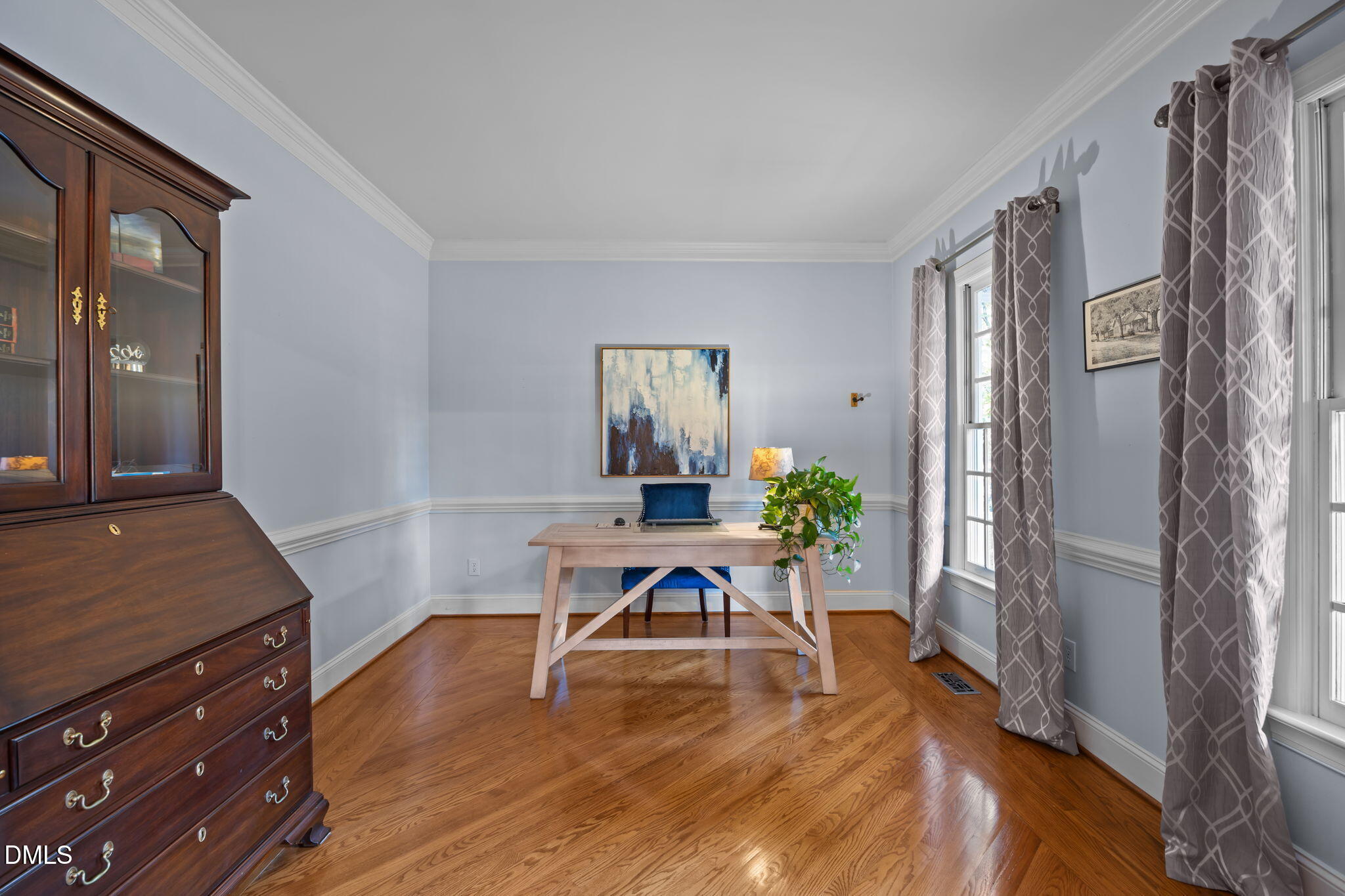 4304 Omni Place Raleigh, NC 27613 - Photo 13 of 58 a living room with furniture and wooden floor