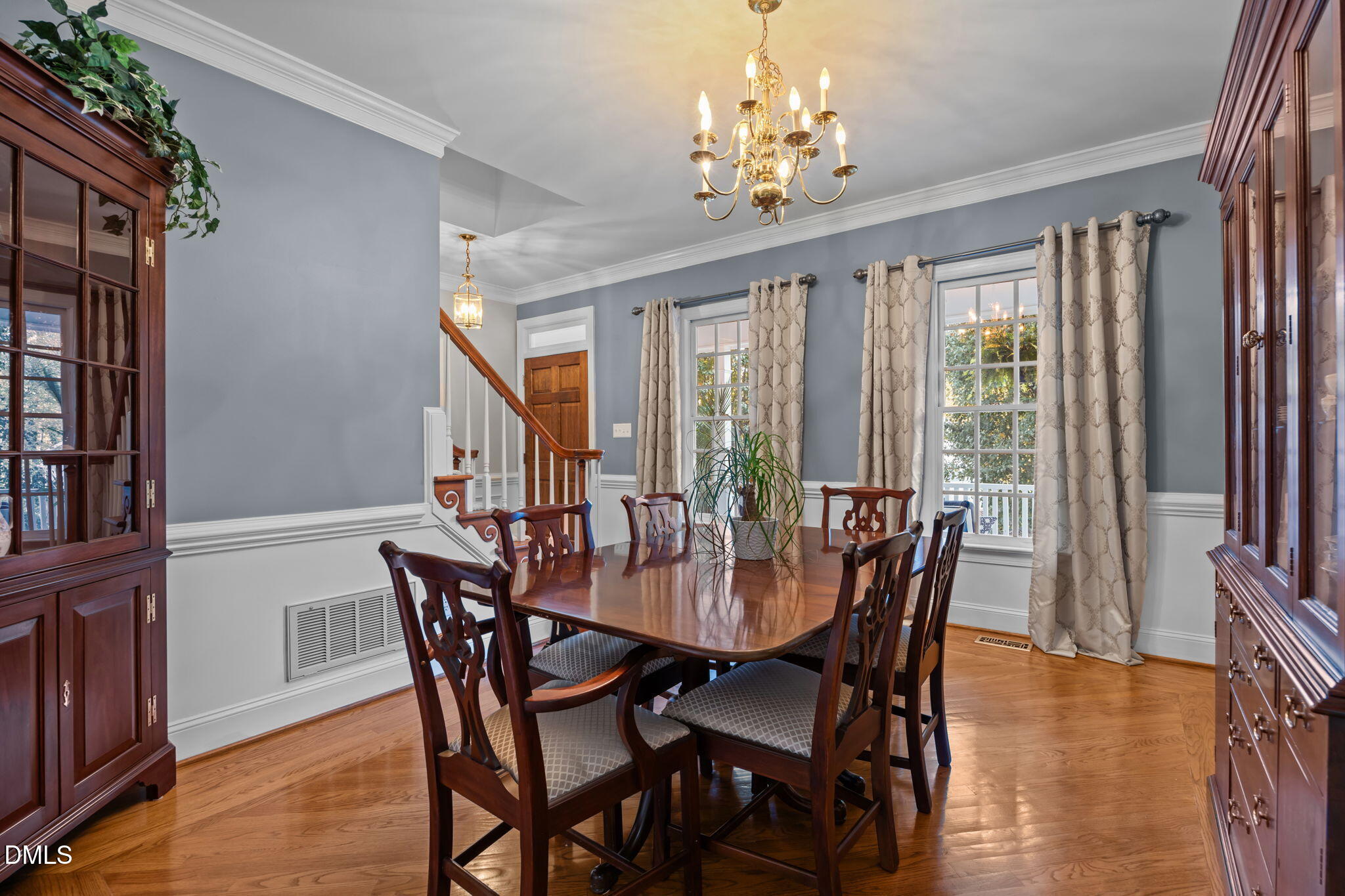 4304 Omni Place Raleigh, NC 27613 - Photo 14 of 58 a view of a dining room with furniture window and wooden floor