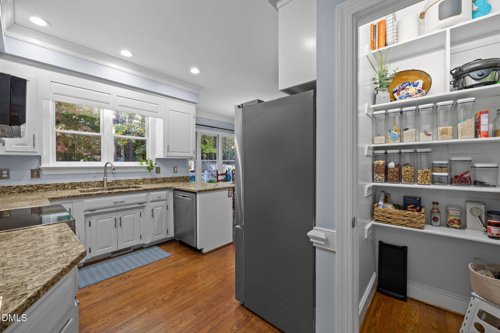 4304 Omni Place Raleigh, NC 27613 - Photo 18 of 58 a kitchen with stainless steel appliances granite countertop a refrigerator and a sink