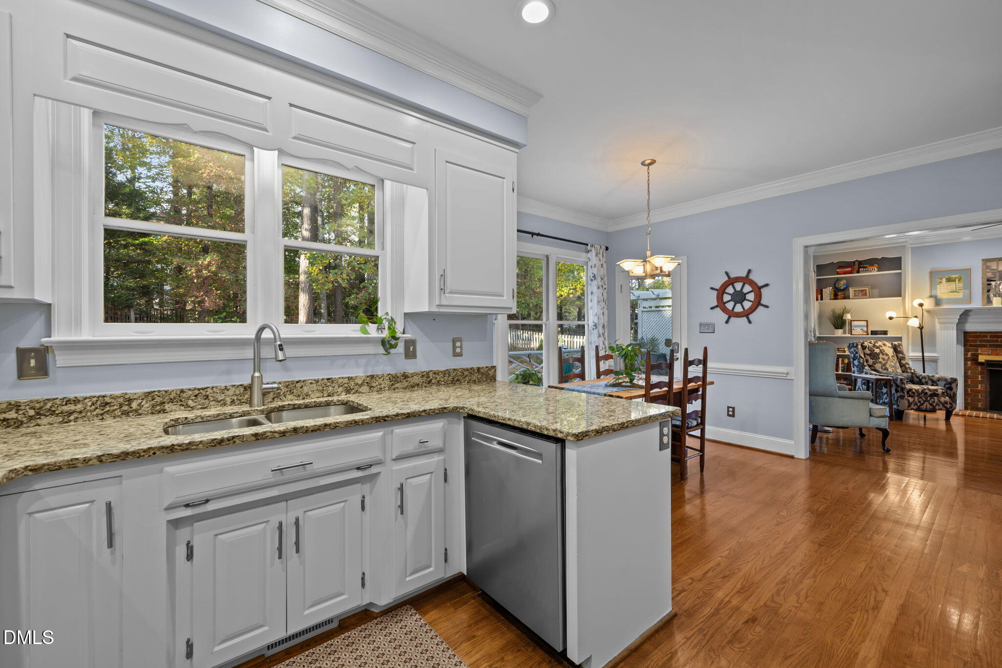 4304 Omni Place Raleigh, NC 27613 - Photo 19 of 58 a kitchen with a sink cabinets and window