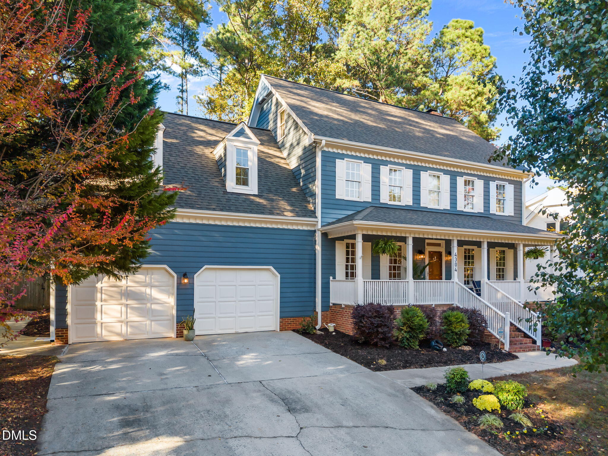 4304 Omni Place Raleigh, NC 27613 - Photo 2 of 58 a front view of a house with a garden and plants