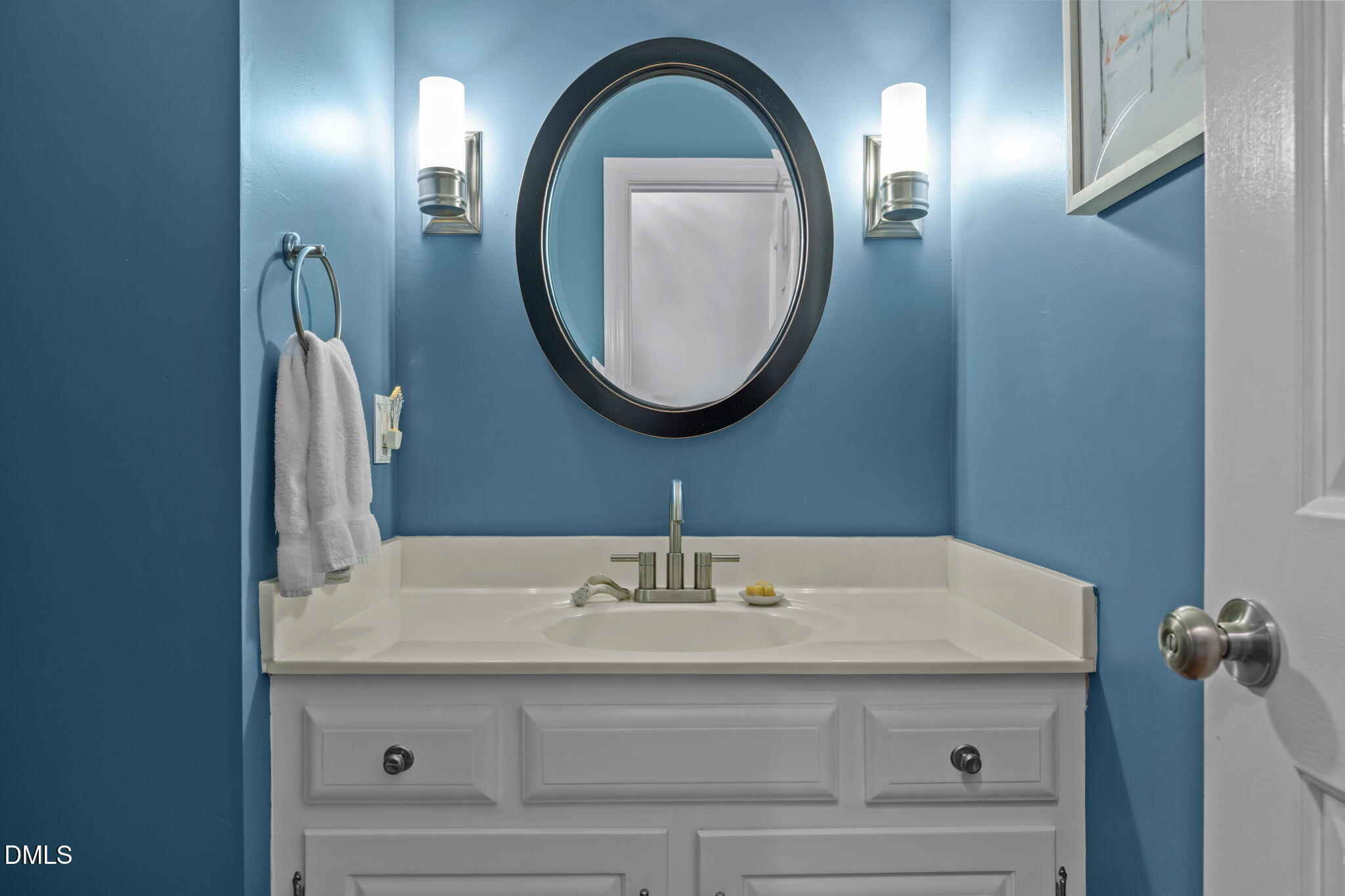 4304 Omni Place Raleigh, NC 27613 - Photo 24 of 58 a bathroom with a sink and a mirror