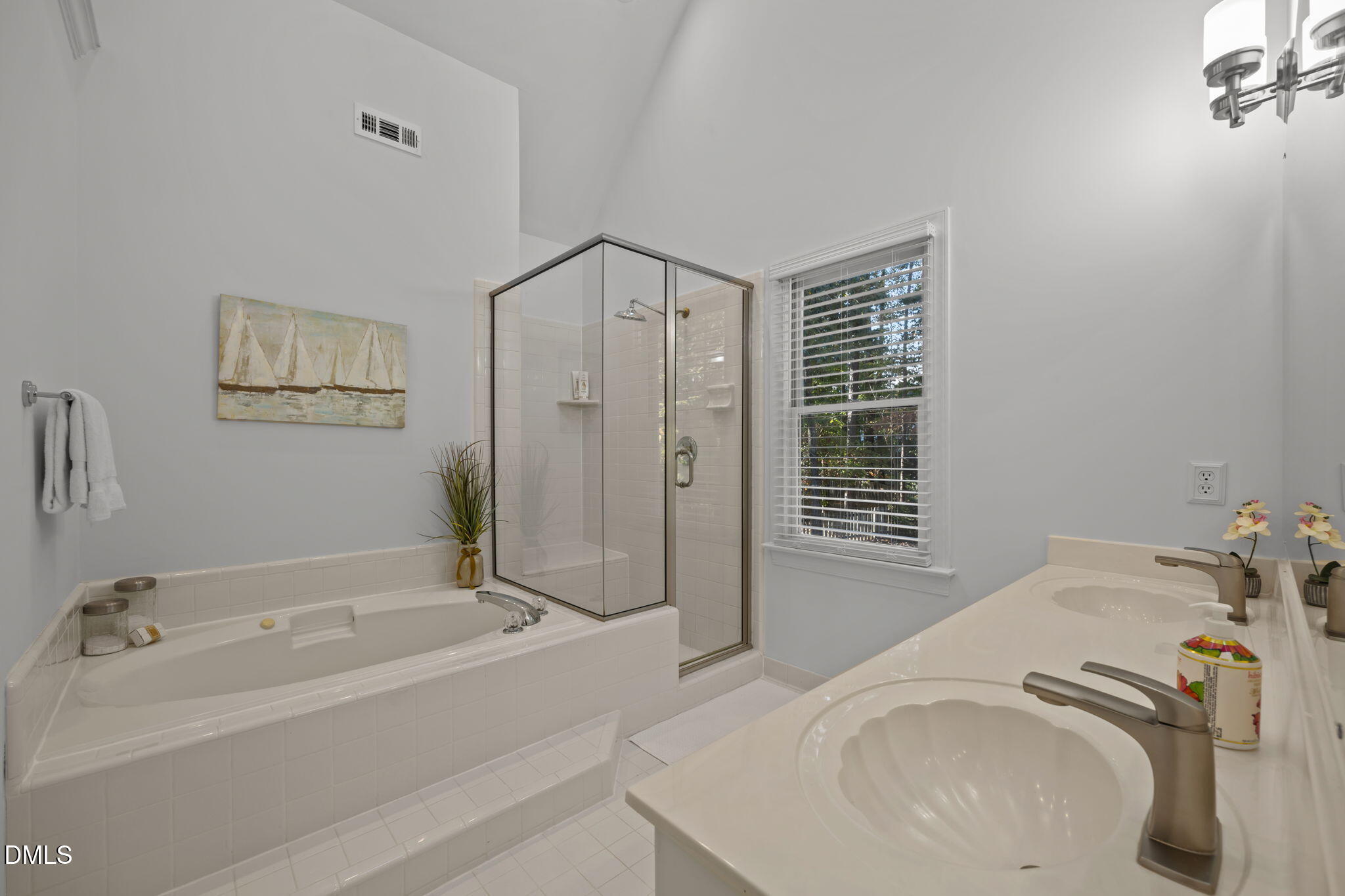 4304 Omni Place Raleigh, NC 27613 - Photo 29 of 58 a bathroom with a tub sink and shower