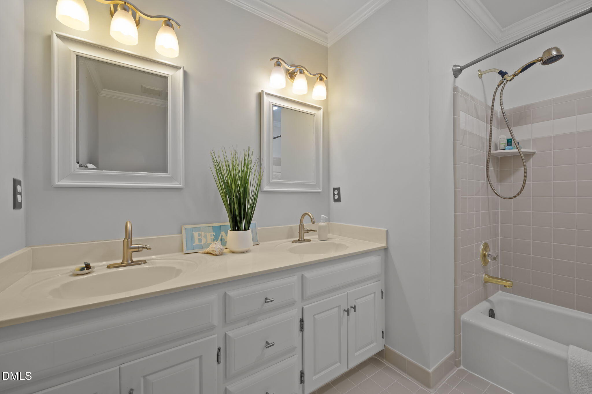 4304 Omni Place Raleigh, NC 27613 - Photo 37 of 58 a bathroom with a granite countertop sink mirror and a bathtub