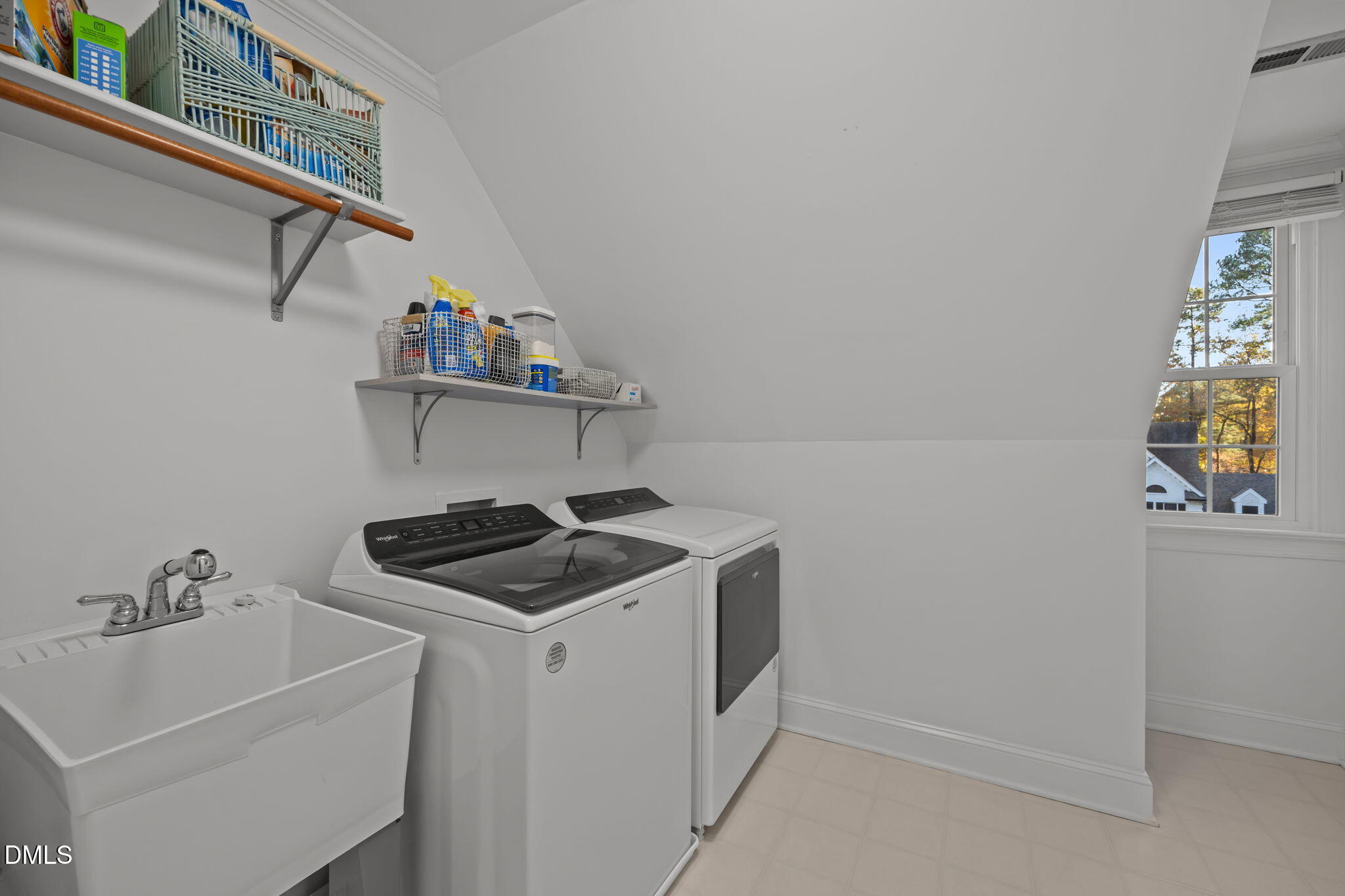 4304 Omni Place Raleigh, NC 27613 - Photo 38 of 58 a kitchen with a sink and cabinets
