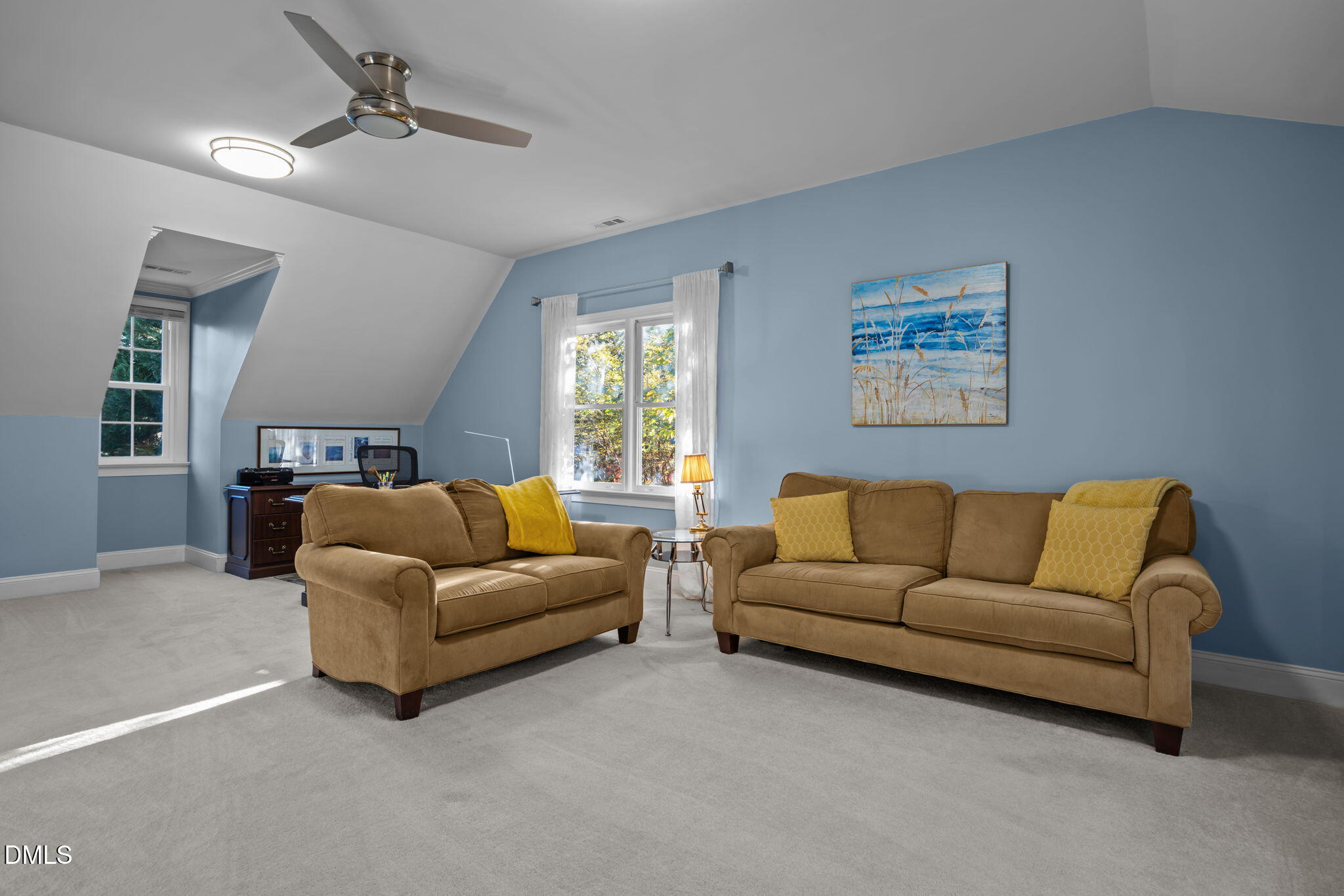 4304 Omni Place Raleigh, NC 27613 - Photo 39 of 58 a living room with furniture and a couch