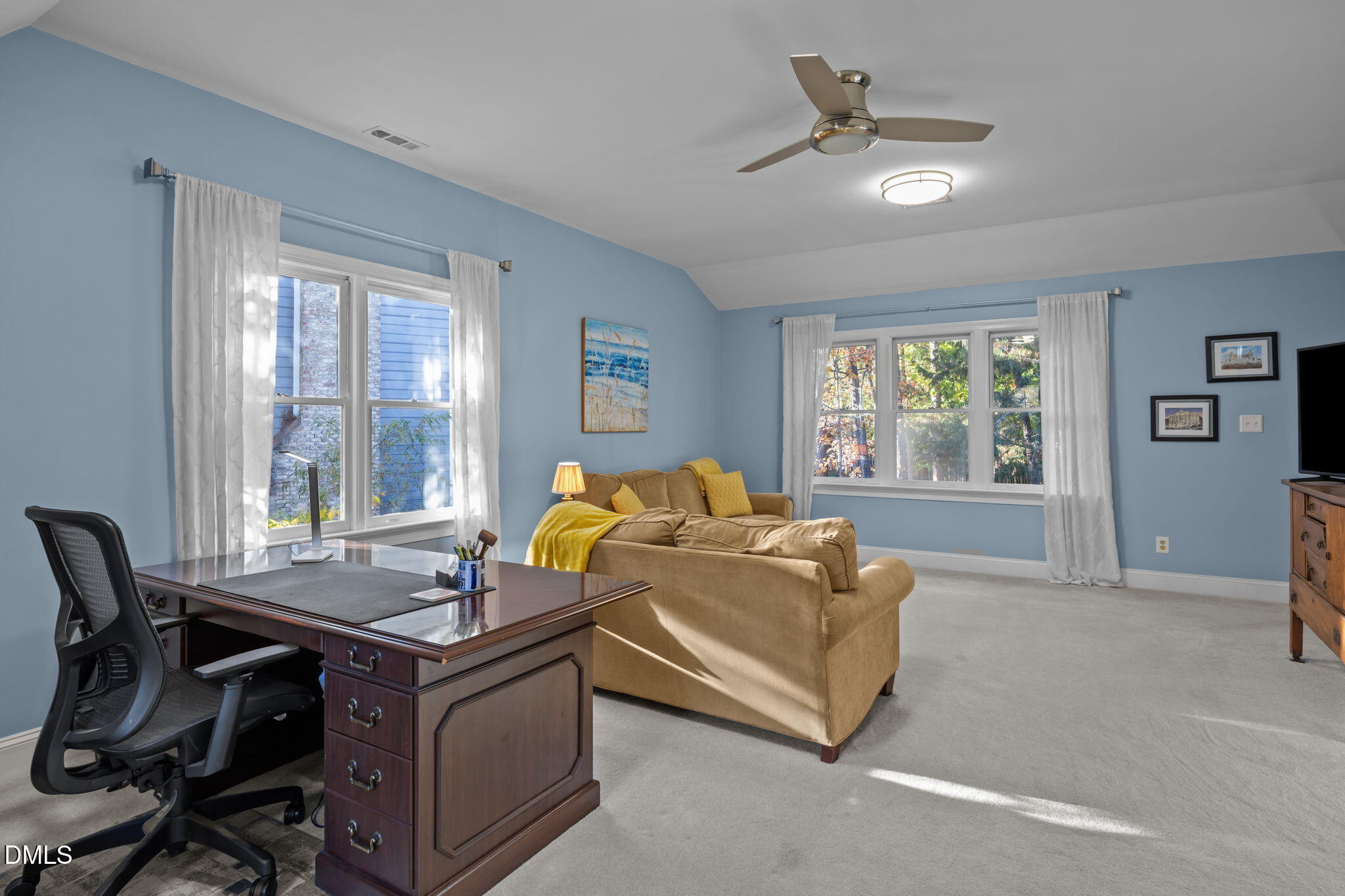 4304 Omni Place Raleigh, NC 27613 - Photo 40 of 58 a bedroom with a bed and a table