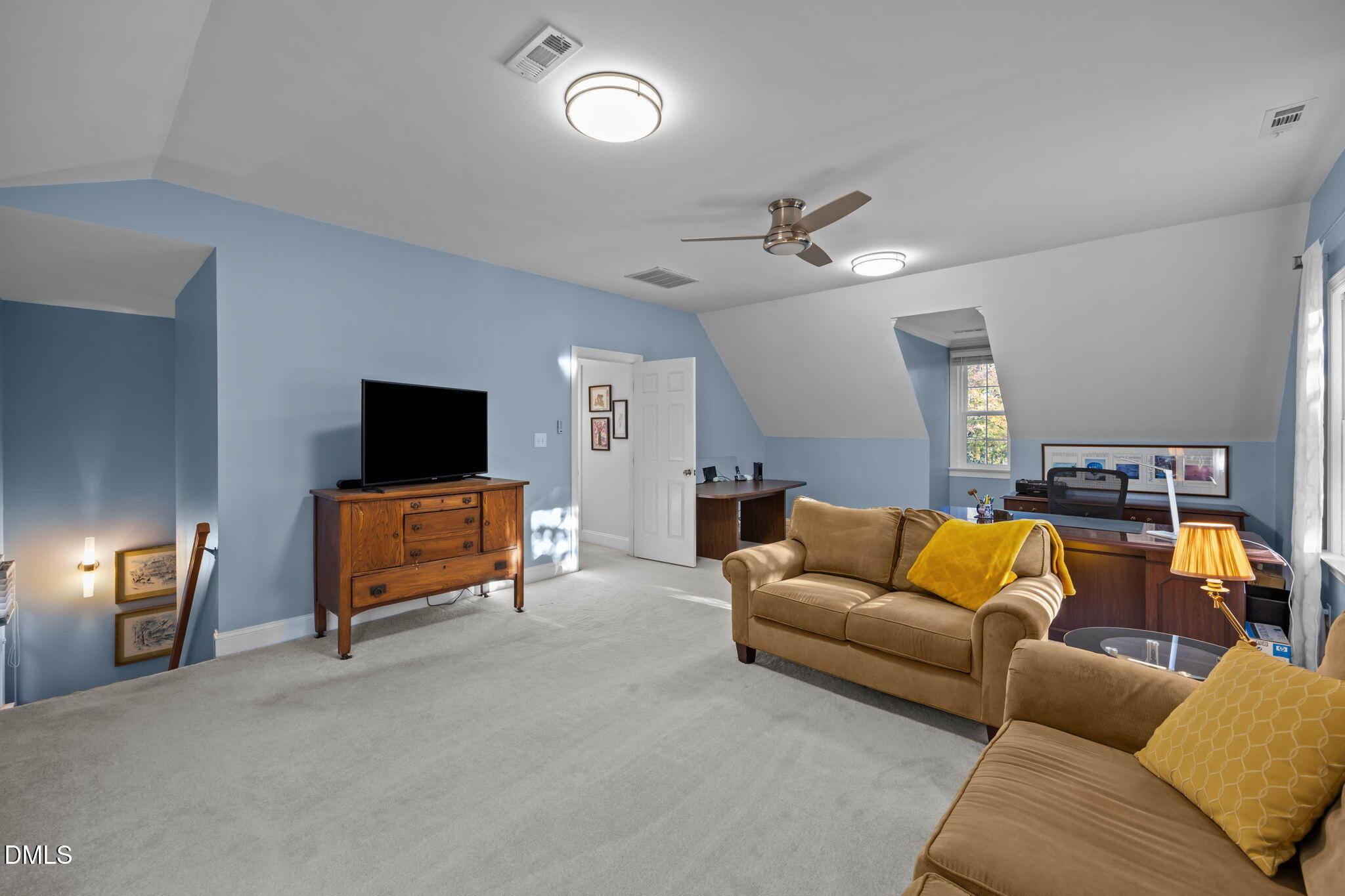 4304 Omni Place Raleigh, NC 27613 - Photo 41 of 58 a living room with furniture and a flat screen tv