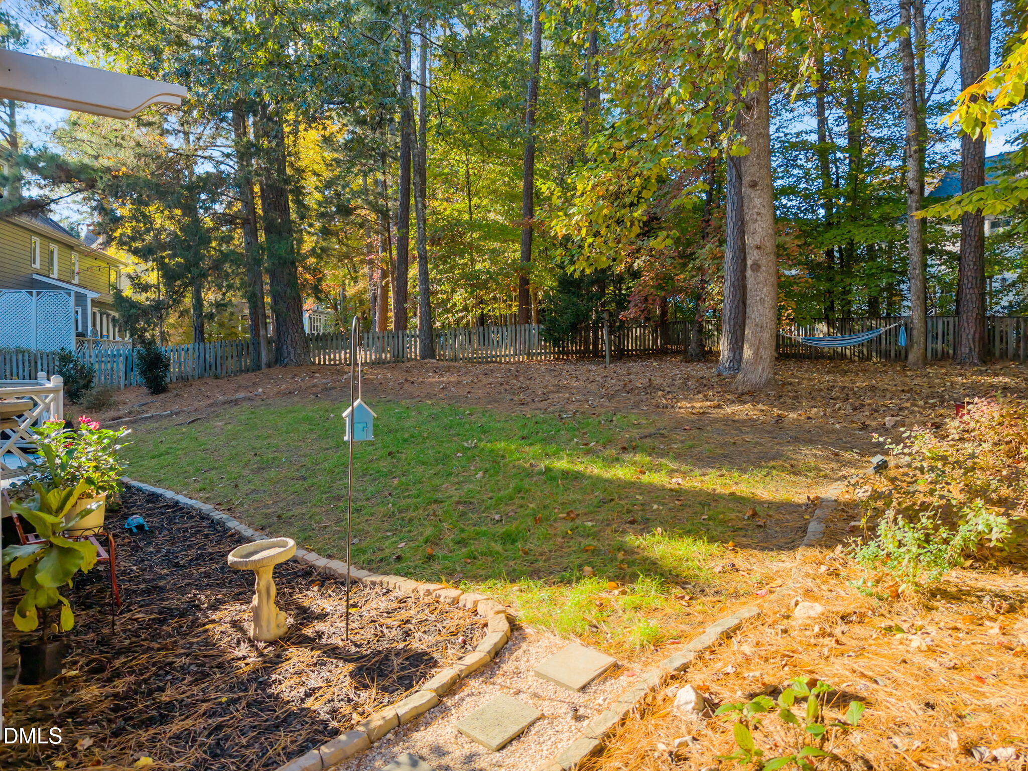 4304 Omni Place Raleigh, NC 27613 - Photo 50 of 58 a backyard of a house with lots of green space