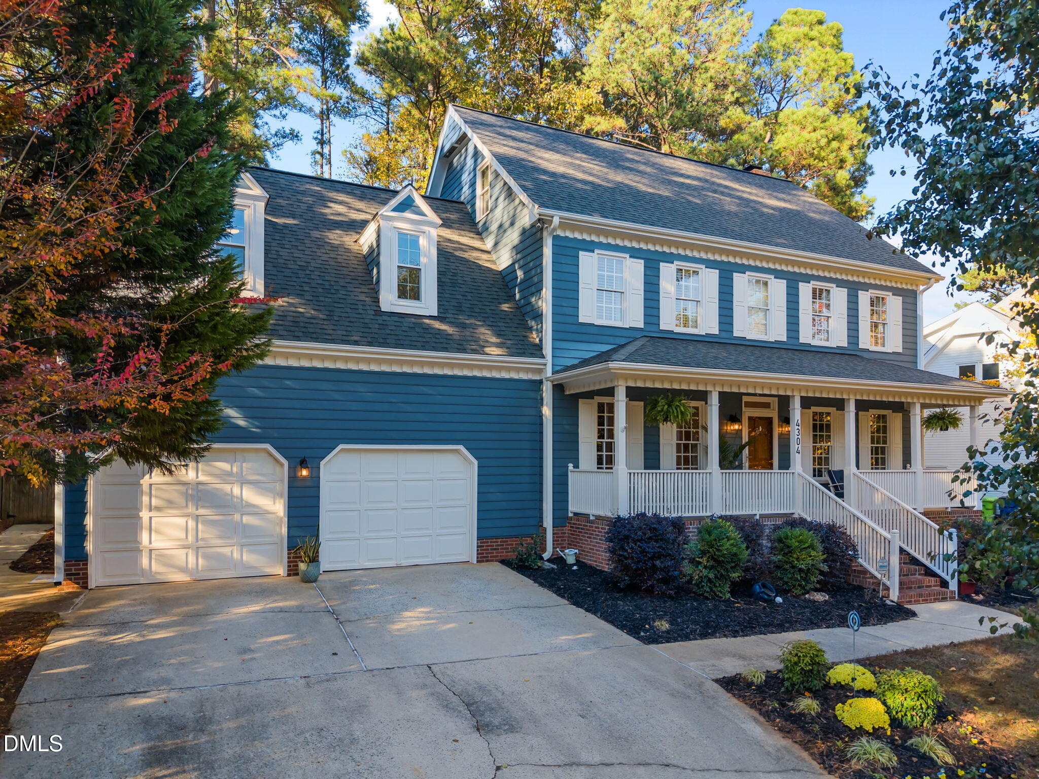 4304 Omni Place Raleigh, NC 27613 - Photo 5 of 58 a front view of a house with a yard and garage