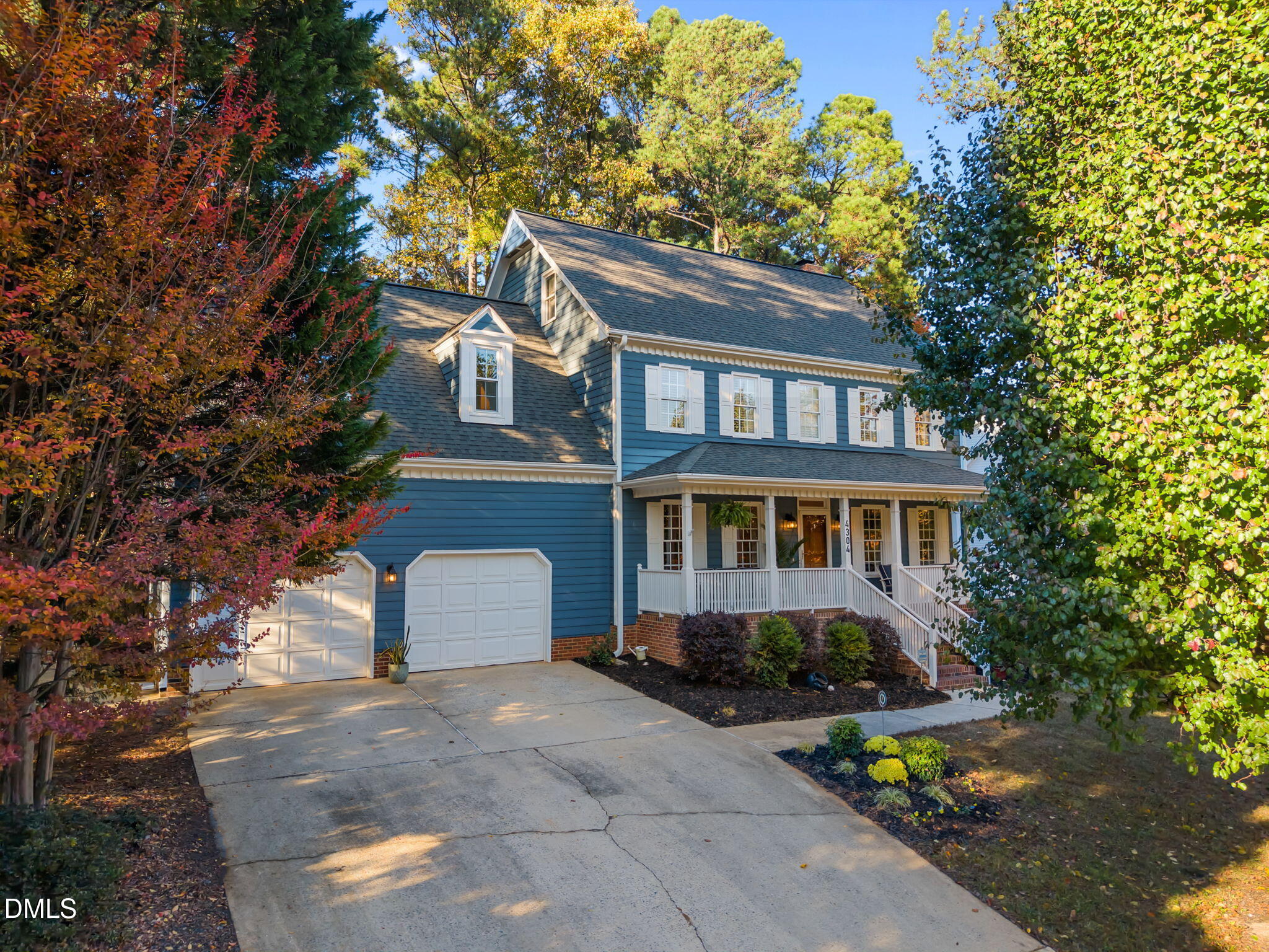 4304 Omni Place Raleigh, NC 27613 - Photo 6 of 58 a front view of a house with a garden
