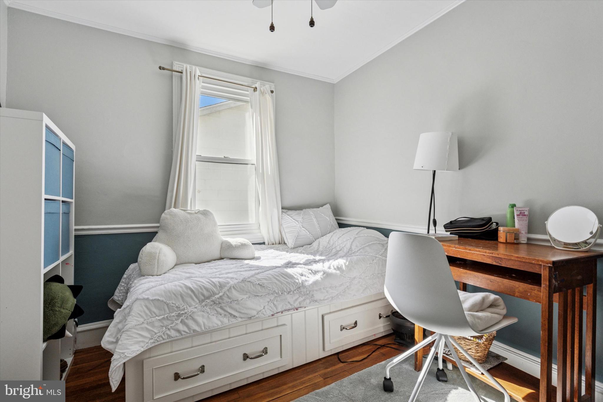 121 Conway Avenue Narberth, PA 19072 - Photo 14 of 27 a bedroom with a bed and a table in it