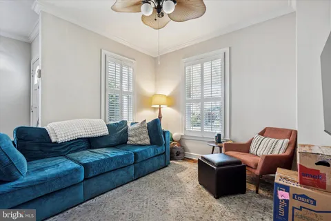 a living room with furniture or couch and a window