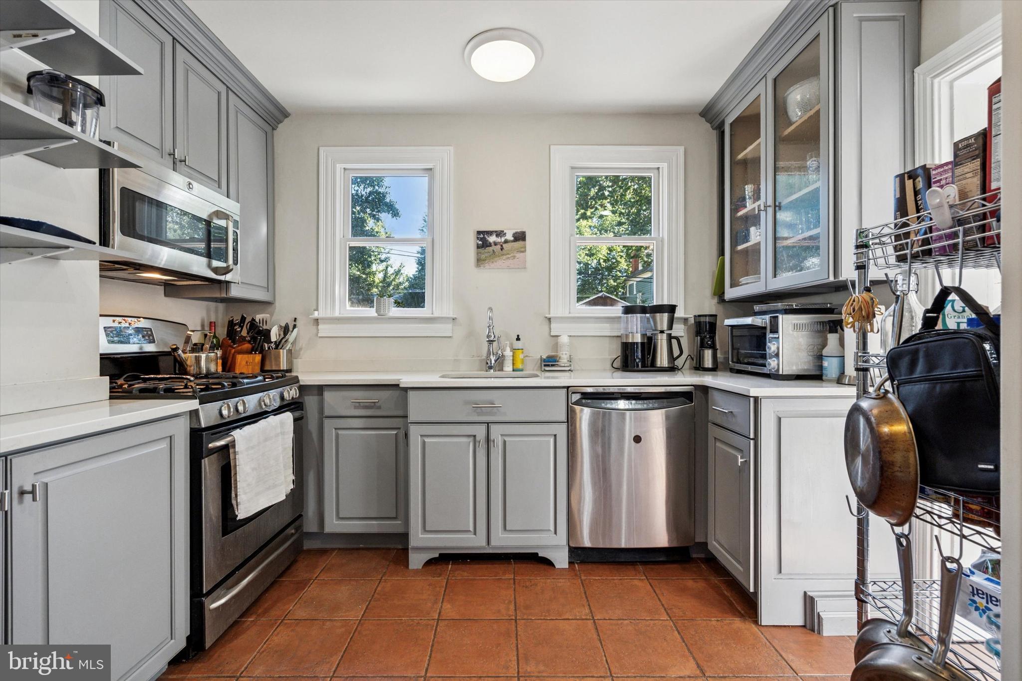 121 Conway Avenue Narberth, PA 19072 - Photo 7 of 27 a kitchen with stainless steel appliances granite countertop a sink and cabinets