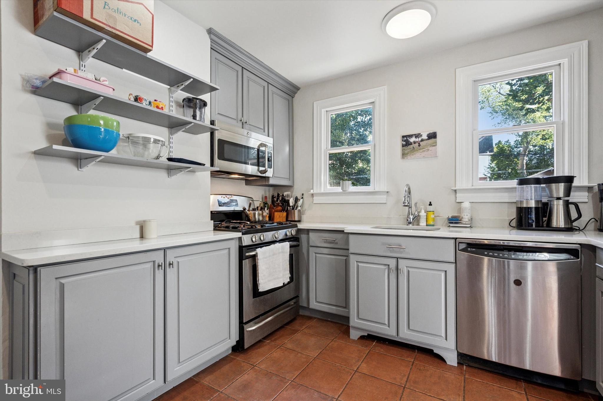 121 Conway Avenue Narberth, PA 19072 - Photo 8 of 27 a kitchen with stainless steel appliances granite countertop a sink and cabinets