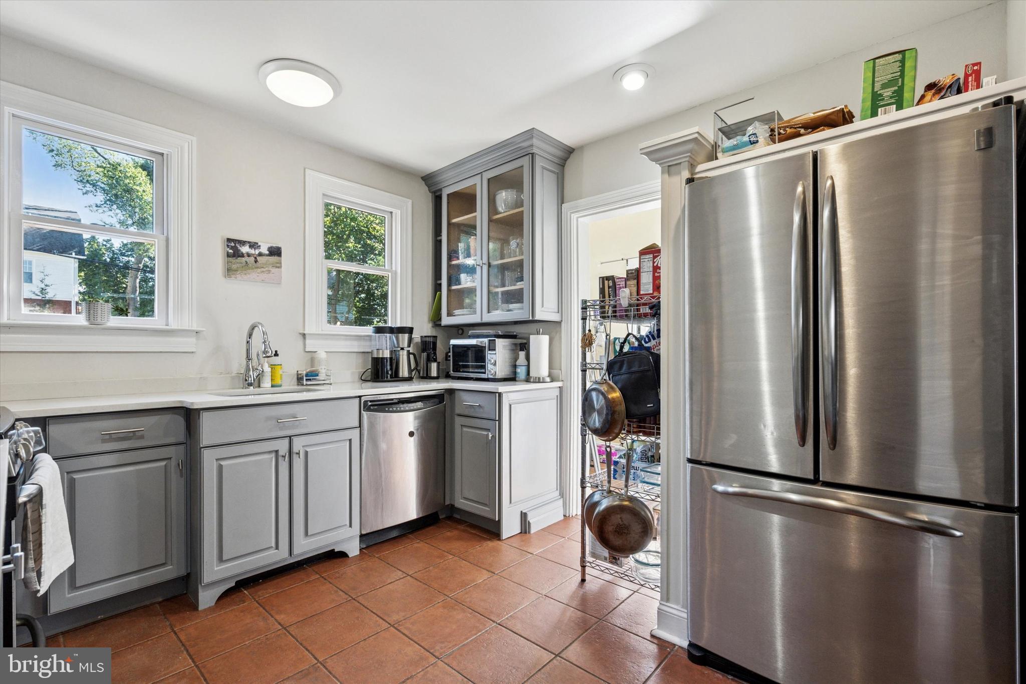 121 Conway Avenue Narberth, PA 19072 - Photo 9 of 27 a kitchen with stainless steel appliances a refrigerator sink and cabinets