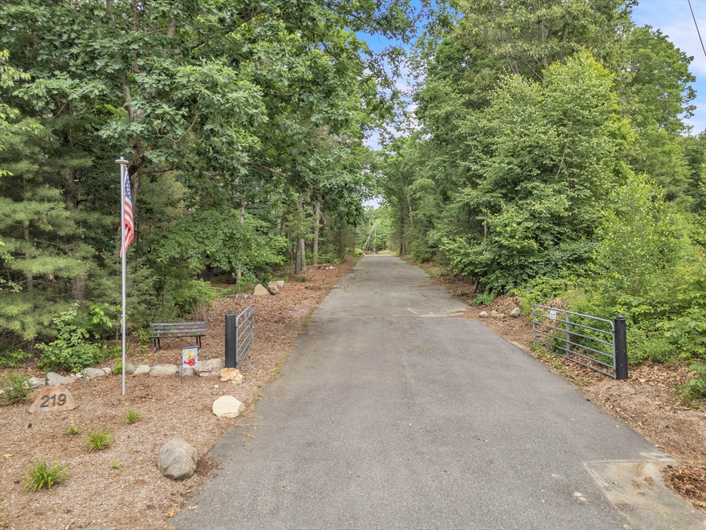 219 Wilbraham Road Monson, MA 01057 - Photo 1 of 19 a backyard of a house with table and chairs
