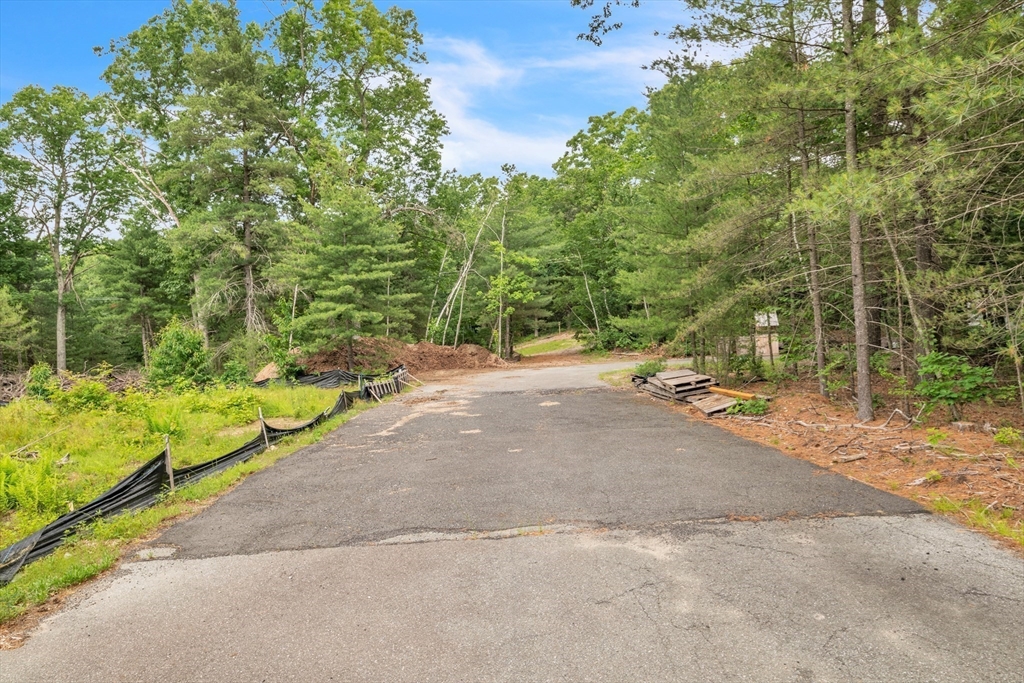 219 Wilbraham Road Monson, MA 01057 - Photo 9 of 19 a view of a street with a bench and trees around