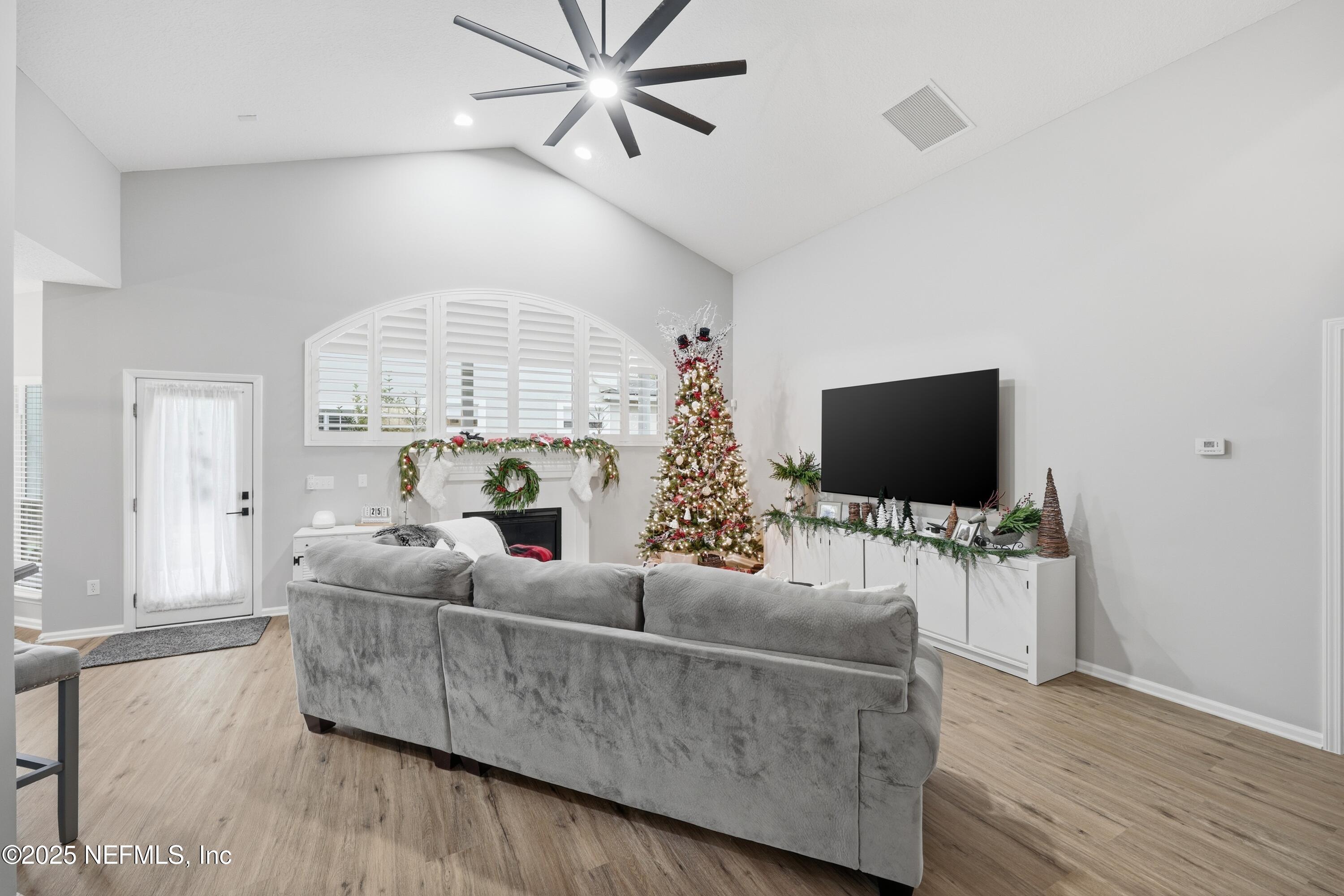 2301 Country Side Drive Fleming Island, FL 32003 - Photo 11 of 58 a living room with furniture and a flat screen tv
