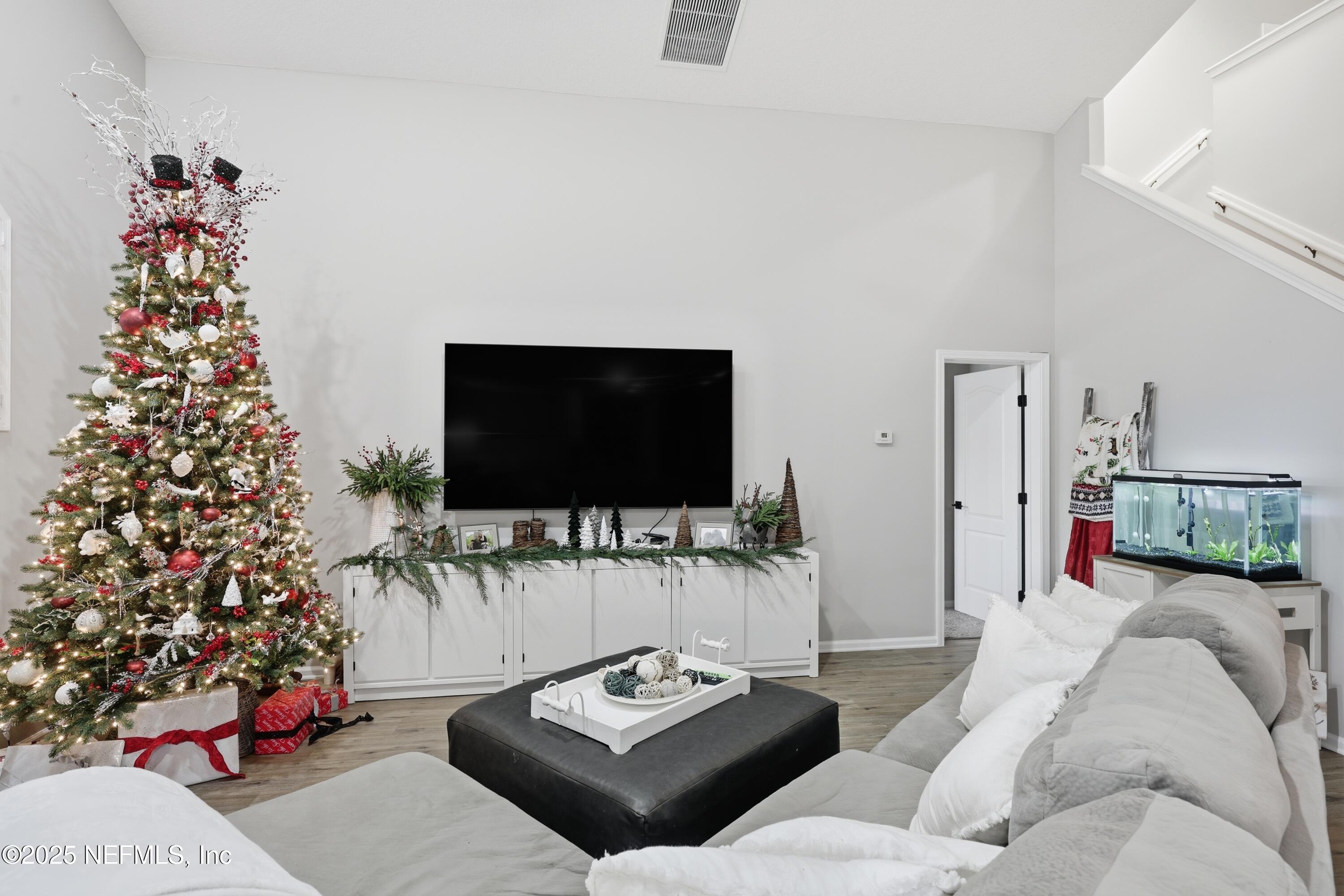 2301 Country Side Drive Fleming Island, FL 32003 - Photo 12 of 58 a living room with furniture and a flat screen tv